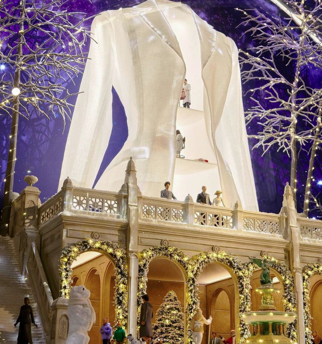 Close view of the jacket window with fountain and figures