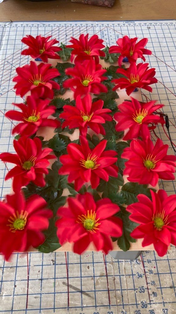 Animatronic flower array on a control board