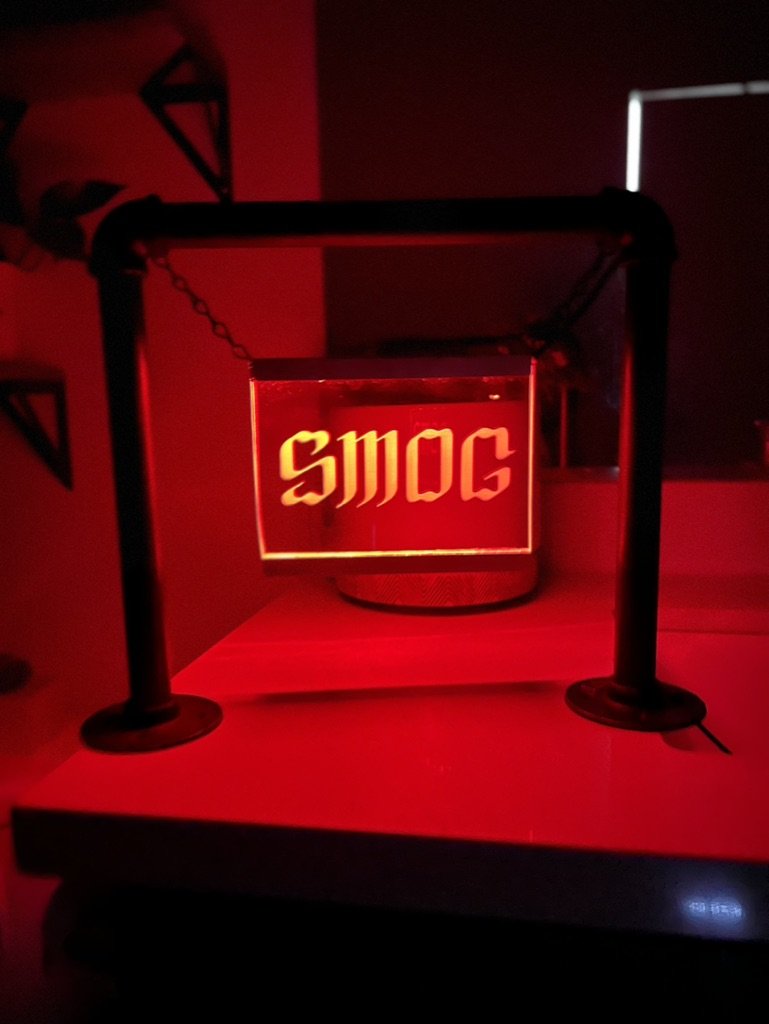 Edge-lit SMOG sign in pipe frame