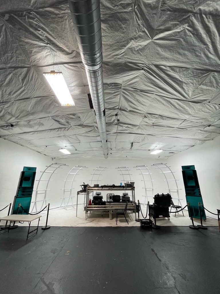 Studio build with teal stacks and white rib structure